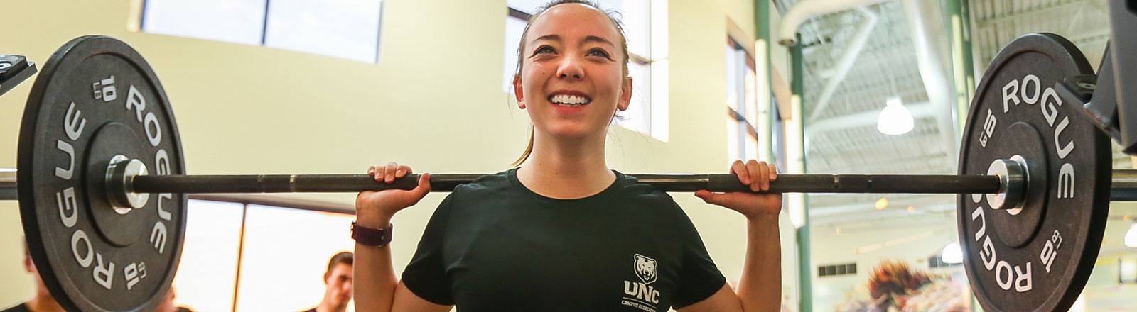 Person participating in crossfit lifting weights