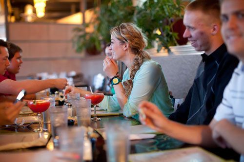 Adults eating at local eatery