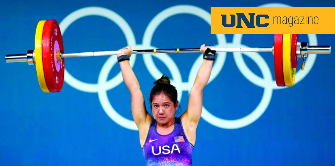 Jourdan Delacruz lifting weight over her head