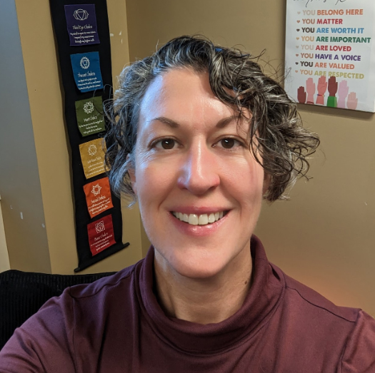 Leslie Hillen looking forward and smiling.