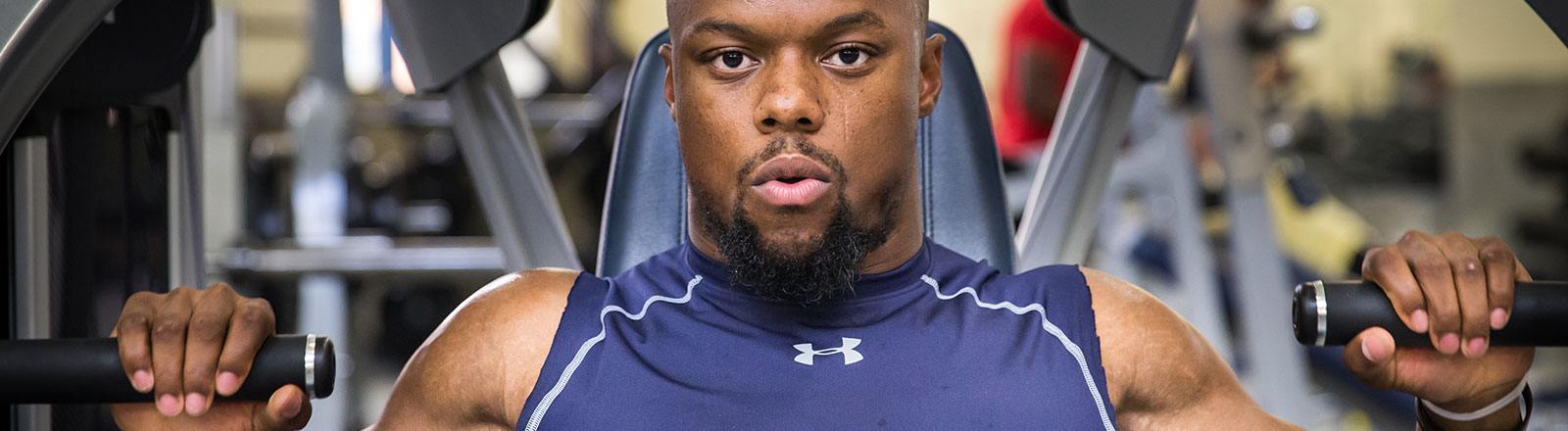 Person using weight machine