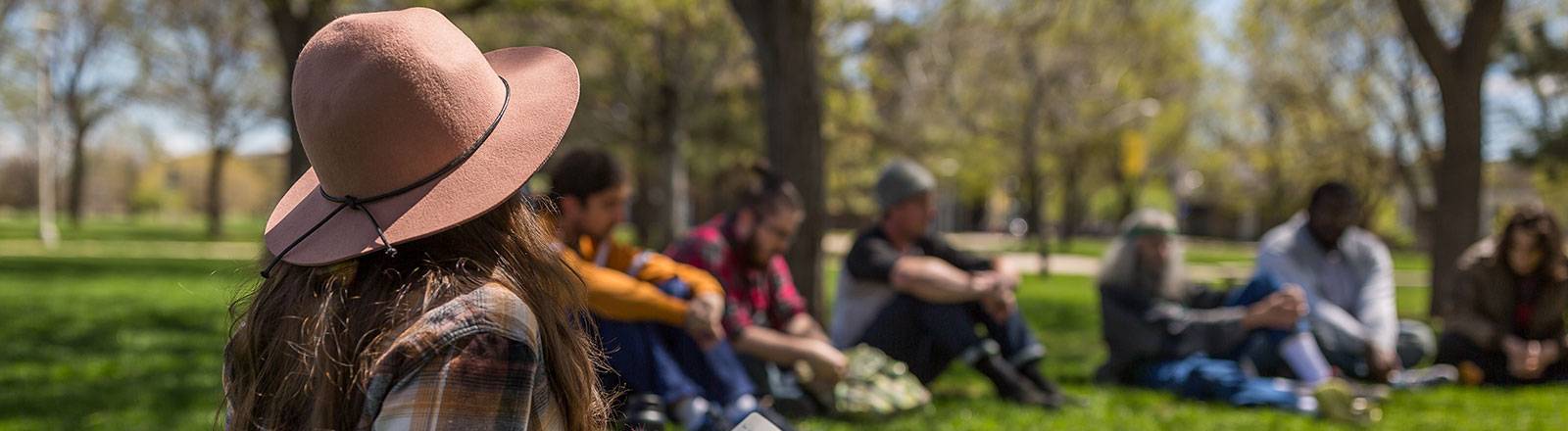 Student sitting in grass