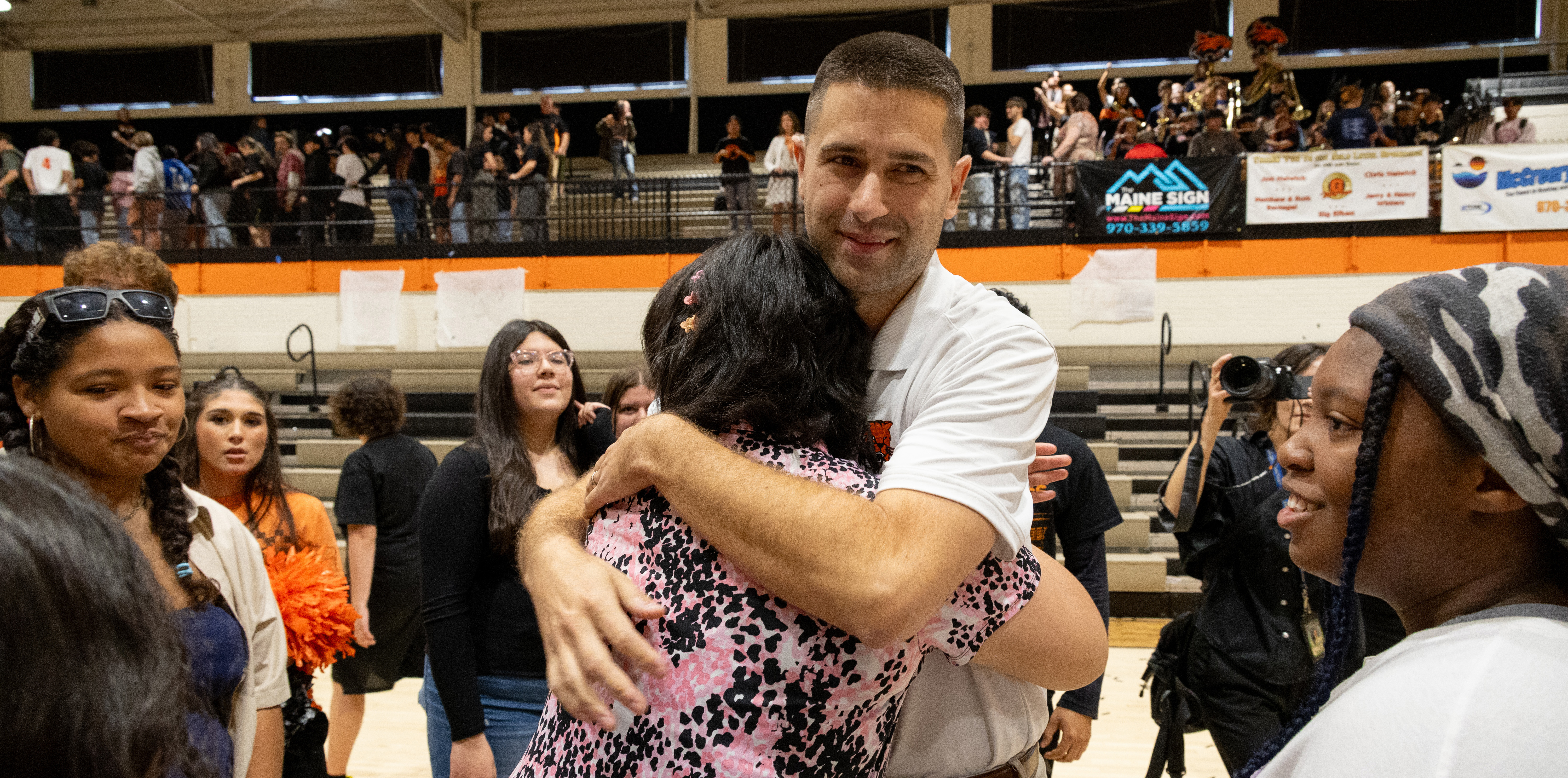 Stephen Paulson hugging a person in celebration