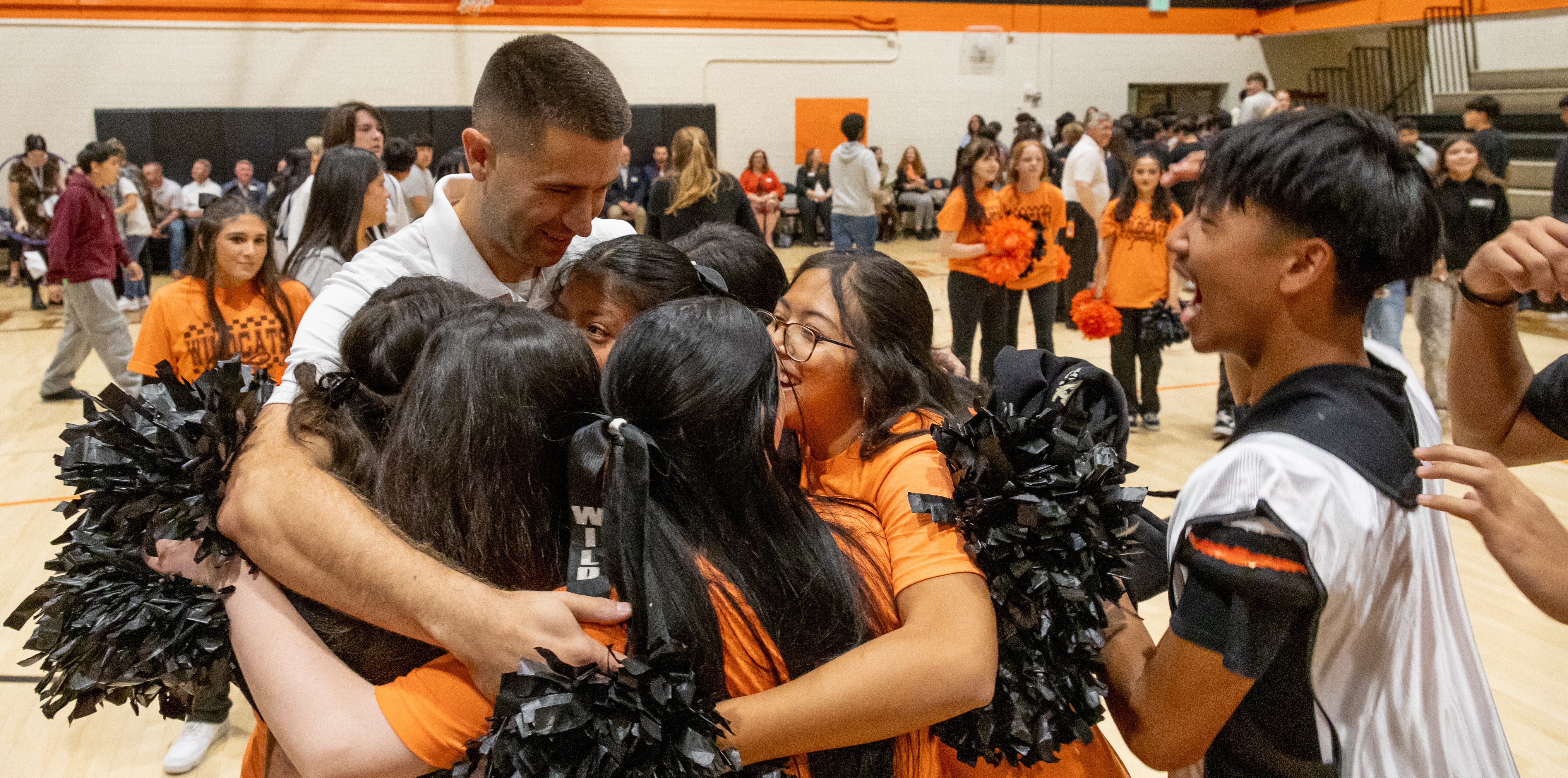 Stephen Paulson celebrating with cheerleaders
