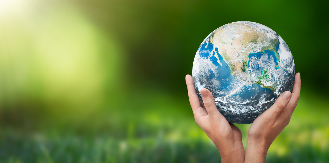 A pair of hands holding the earth