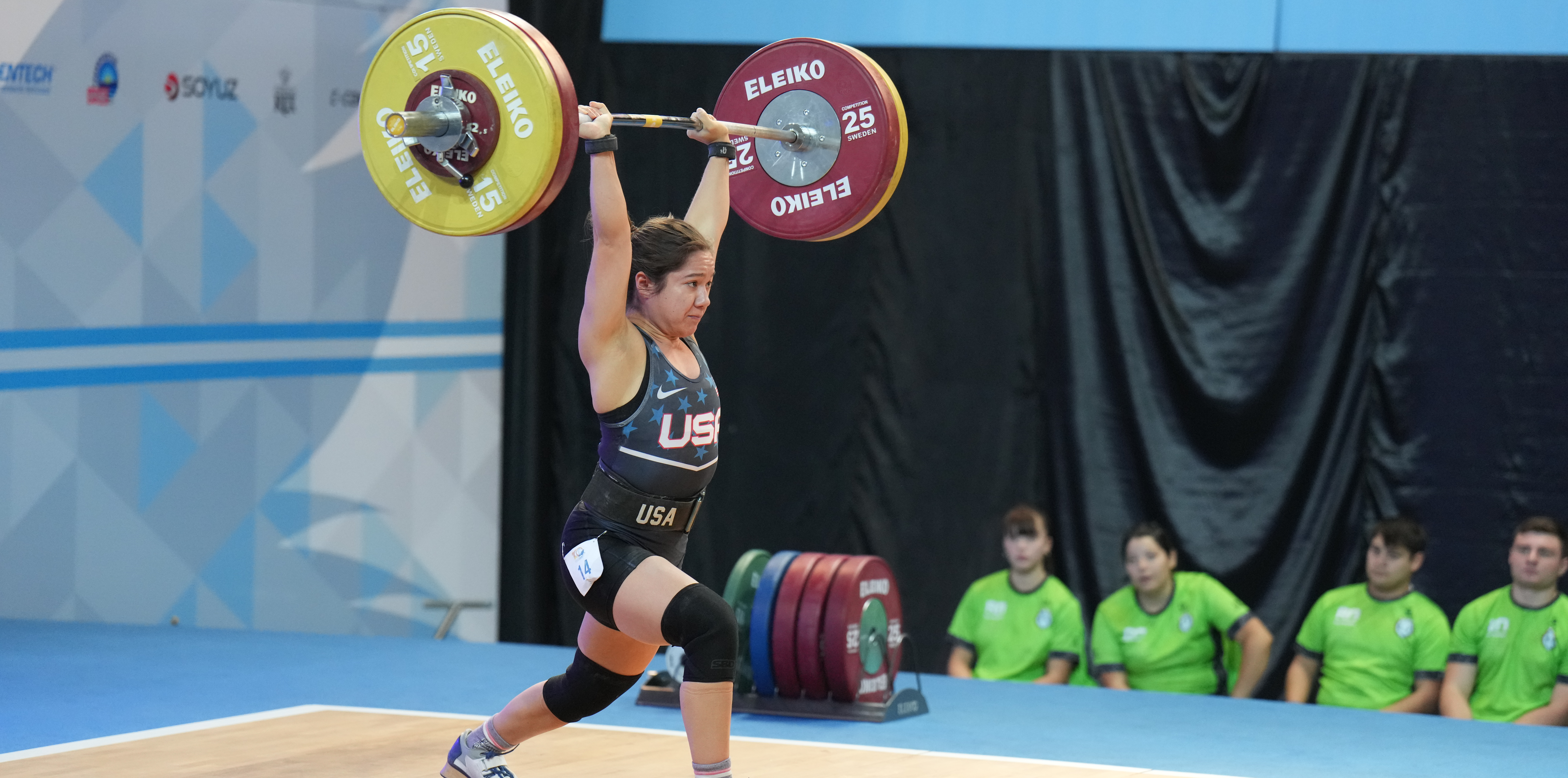 Jourdan Delacruz lifting a ton of weight over her head